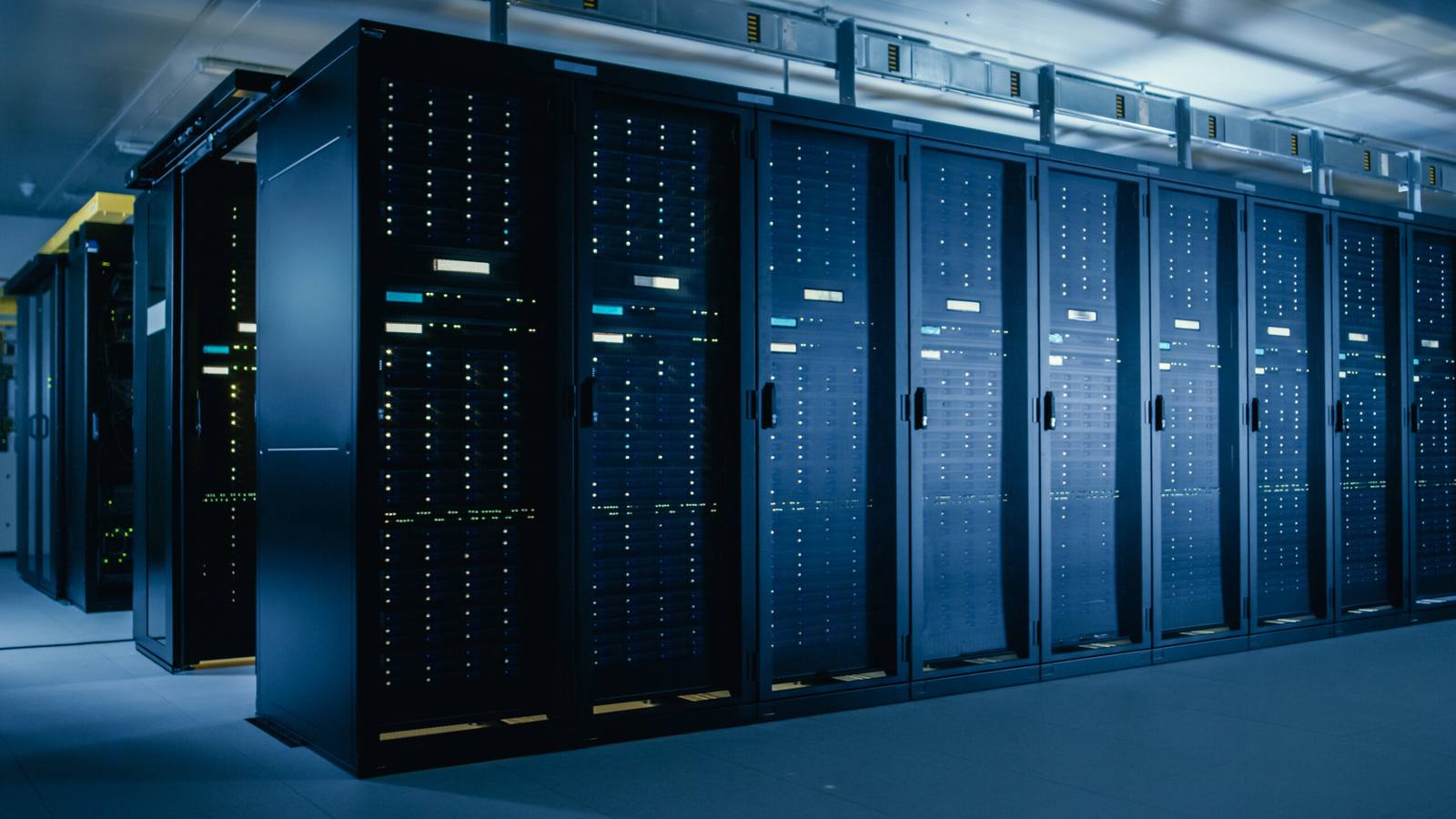 Rows of operational data center server racks in a live facility